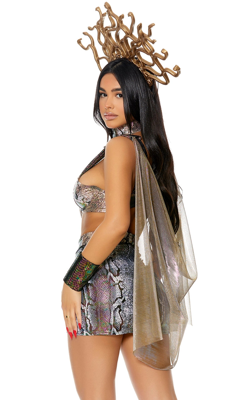 Model wearing a sexy Medusa costume featuring a metallic snake-print bra top with chains, matching mini skirt, choker, wristlets, and snake crown headpiece.